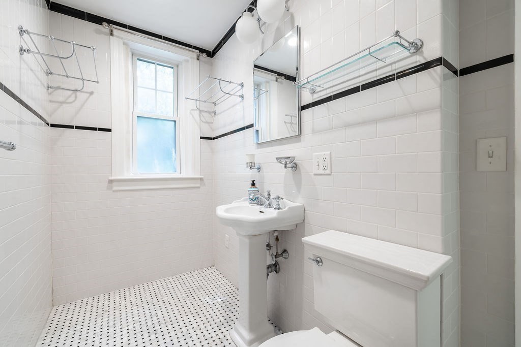 321 Tappan Street, Unit 2 Brookline, MA 02445 - Photo 20 of 25 a bathroom with a sink a toilet and shower