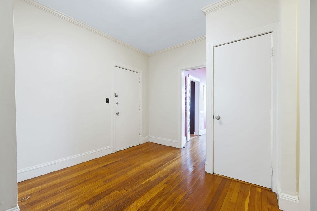 321 Tappan Street, Unit 2 Brookline, MA 02445 - Photo 2 of 25 a view of a room with wooden floor