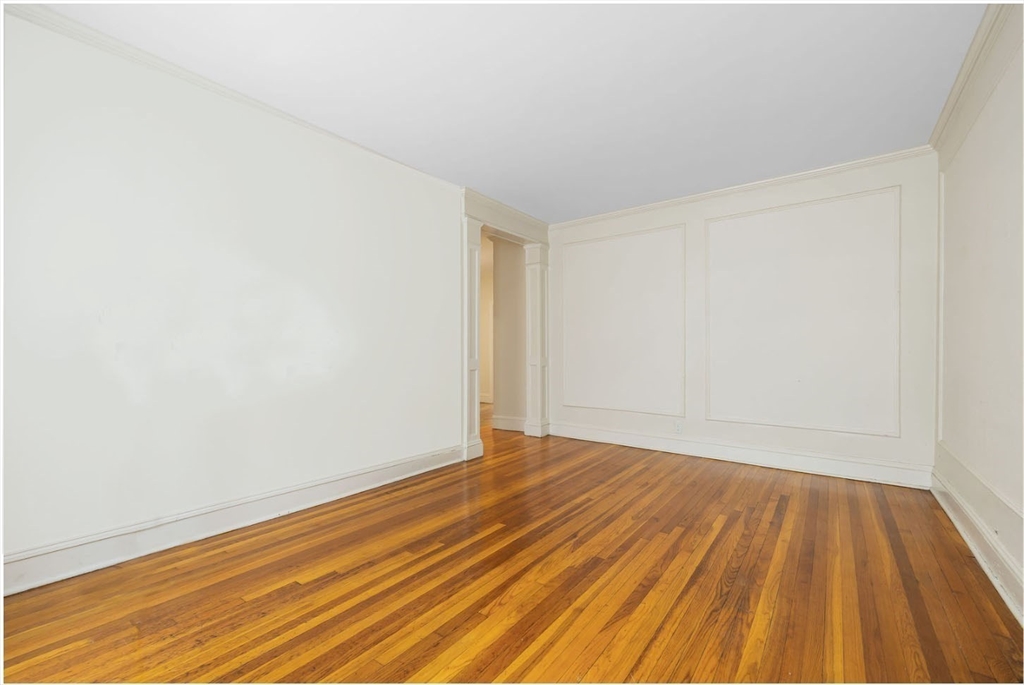 321 Tappan Street, Unit 2 Brookline, MA 02445 - Photo 5 of 25 a view of an empty room with wooden floor