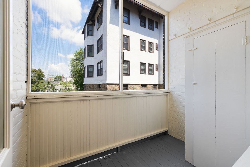 321 Tappan Street, Unit 2 Brookline, MA 02445 - Photo 8 of 25 a close up of a wall with a large window