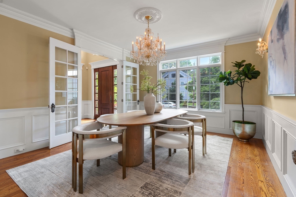 22 Scotney Road Newton, MA 02467 - Photo 11 of 42 a view of a dining room with furniture window and wooden floor