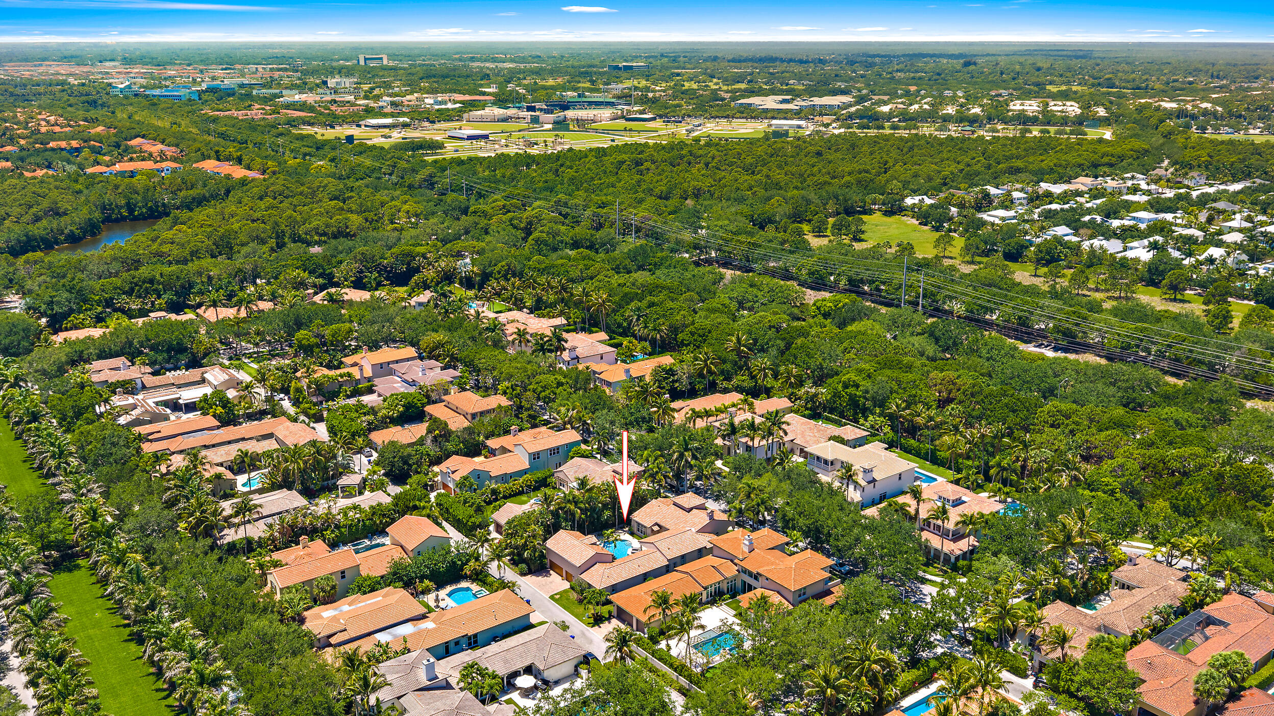 105 Segovia Way Jupiter, FL 33458 - Photo 25 of 33 an aerial view of residential houses with outdoor space and trees