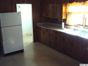 2471 Starnes Road Edgemoor, SC 29712 - Photo 4 of 10 a kitchen with a refrigerator and a sink