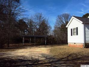 2471 Starnes Road Edgemoor, SC 29712 - Photo 9 of 10 a view of house with backyard and trees in the background