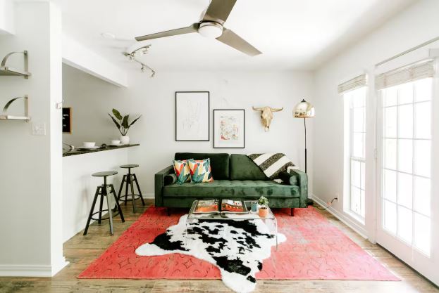 1510 West 6th Street, Unit 110 Austin, TX 78703 - Photo 2 of 18 a room with furniture a rug and a window