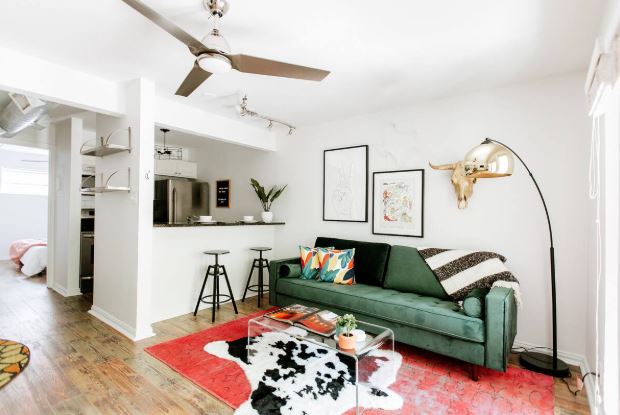 1510 West 6th Street, Unit 110 Austin, TX 78703 - Photo 3 of 18 a living room with furniture and wooden floor
