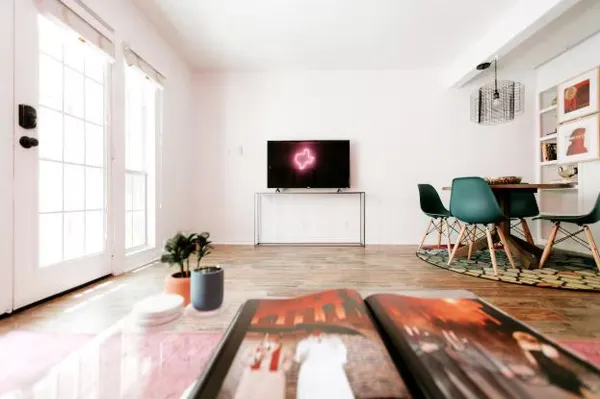 a living room with furniture and a flat screen tv