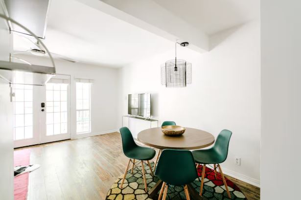 1510 West 6th Street, Unit 110 Austin, TX 78703 - Photo 7 of 18 a view of a dining room with furniture and wooden floor