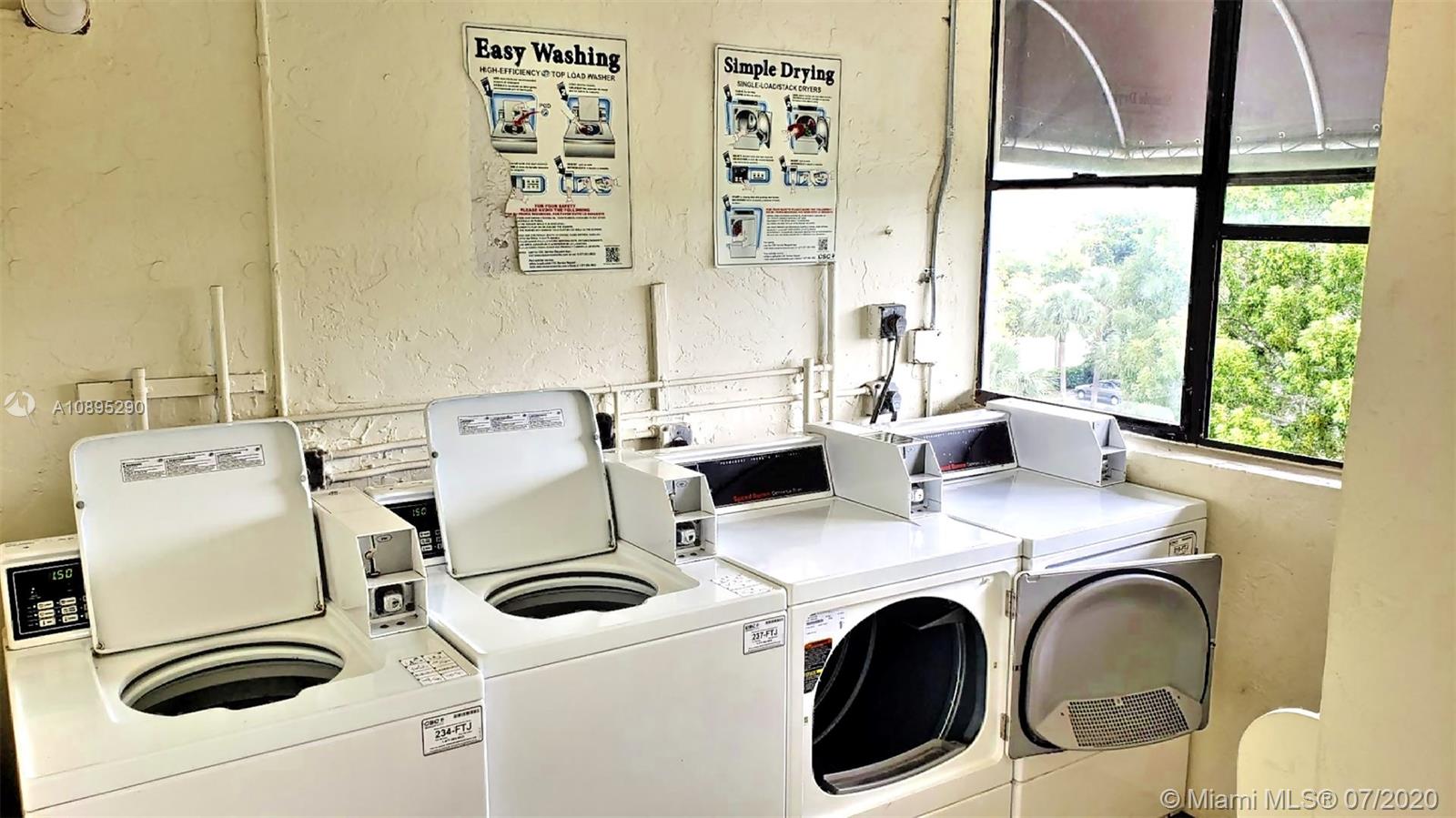 2701 Riverside Drive, Unit 514B Coral Springs, FL 33065 - Photo 16 of 22 a utility room with dryer and washer