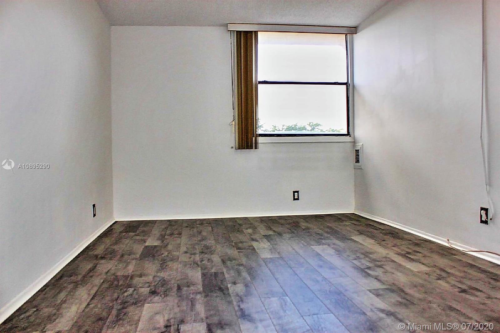 2701 Riverside Drive, Unit 514B Coral Springs, FL 33065 - Photo 8 of 22 an empty room with a window