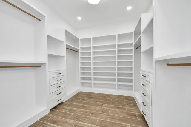 a view of cabinets with wooden floor