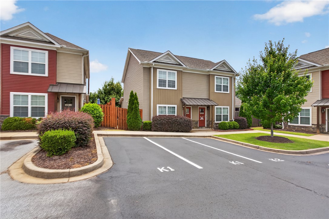 235 Pendleton Road, Unit K1 Clemson, SC 29631 - Photo 3 of 49 A well-maintained facade features mature landscaping and convenient paved parking.