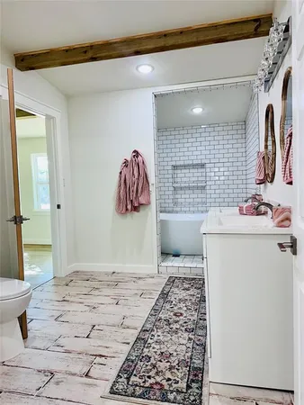 a bedroom with a bed and a couch