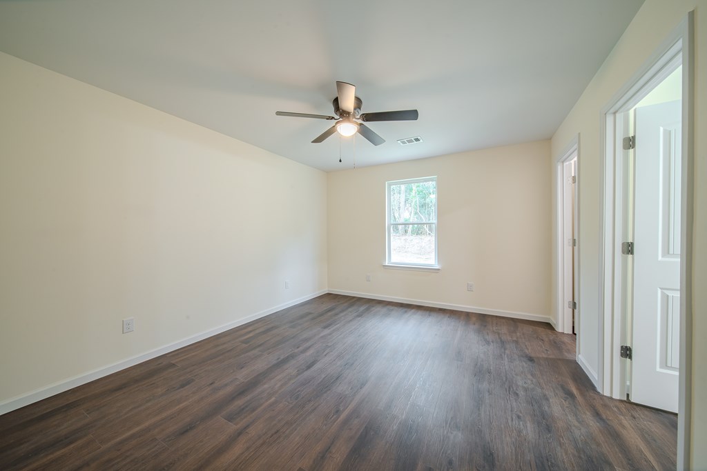 4402 Forrest Road Columbus, GA 31907 - Photo 19 of 28 wooden floor in an empty room with a window