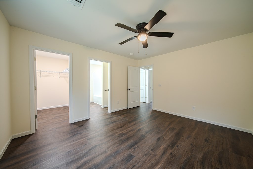 4402 Forrest Road Columbus, GA 31907 - Photo 20 of 28 an empty room with wooden floor and windows