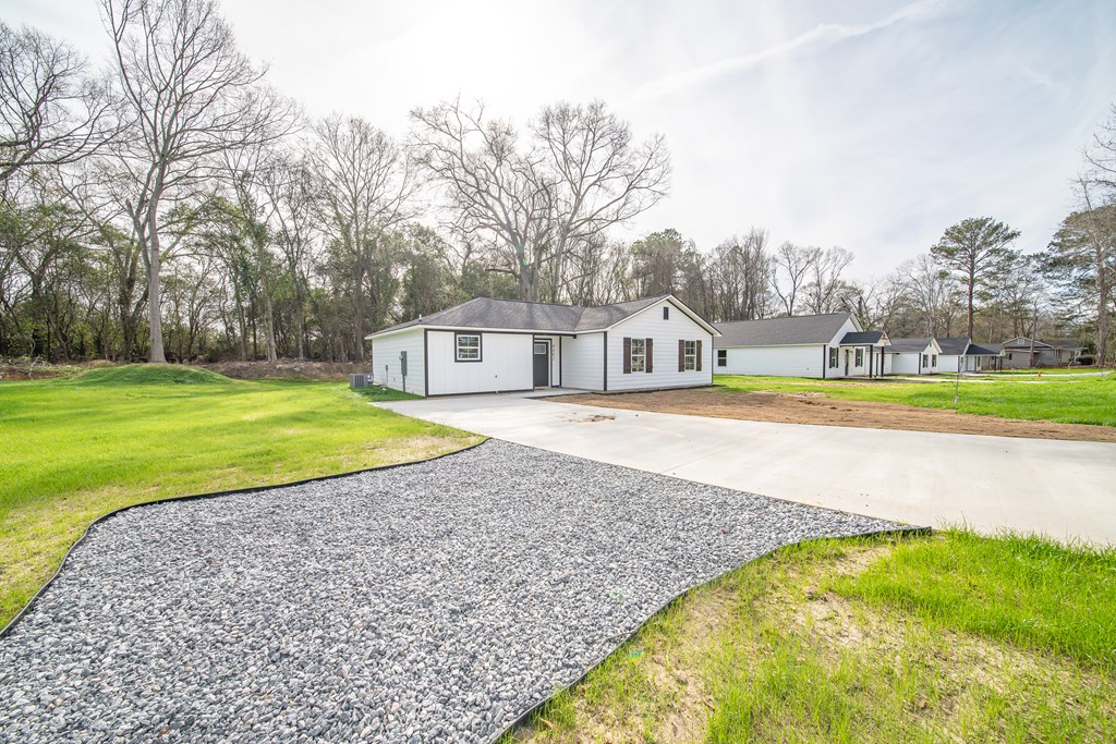 4402 Forrest Road Columbus, GA 31907 - Photo 2 of 28 a view of an swimming pool with a yard and large trees