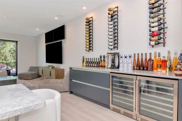 a bathroom with a double vanity sink mirror and shower