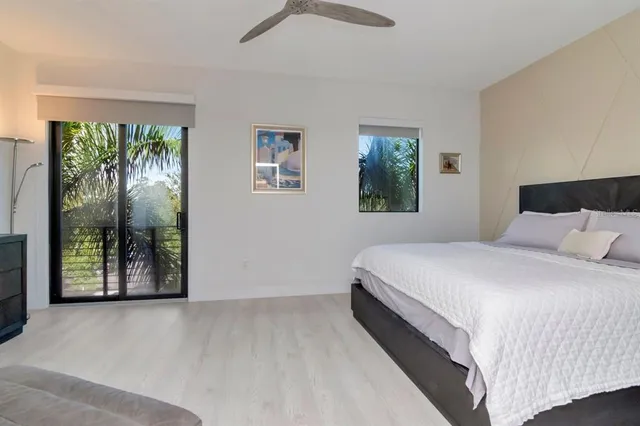 a view of a balcony with lake view and a potted plant