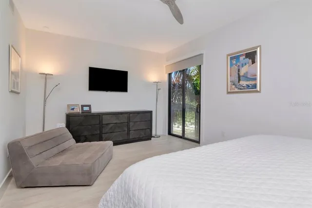 a front view of a house with yard and tree