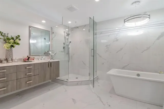 a view of a house with a yard and potted plants