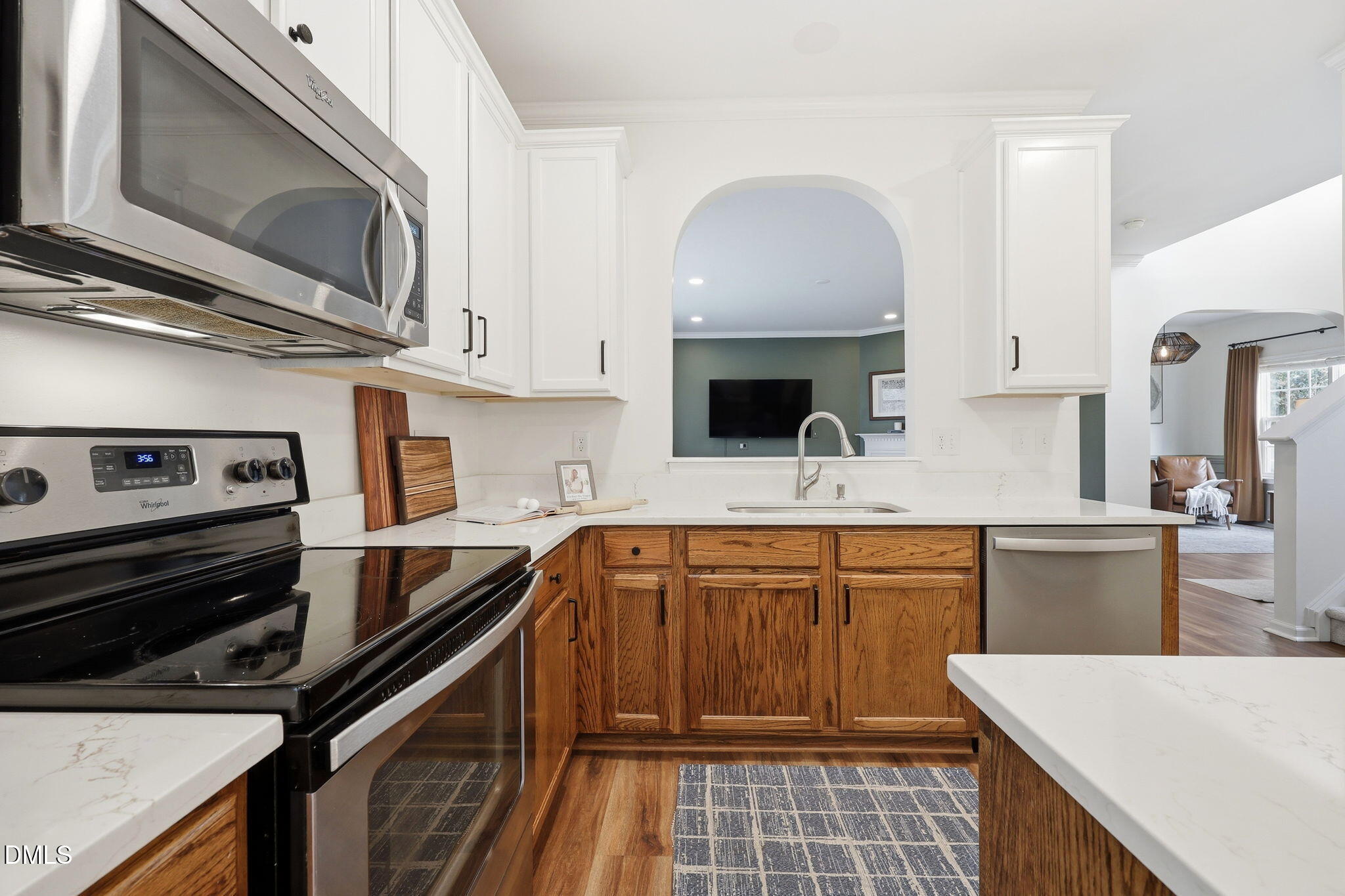 5629 Enoree Lane Raleigh, NC 27616 - Photo 13 of 38 a kitchen with stainless steel appliances a sink stove and cabinets