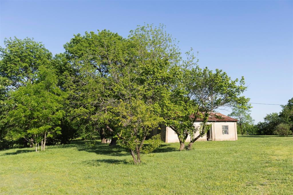 3183 Harrell Road Howe, TX 75459 - Photo 37 of 40 a yellow house with trees in the background
