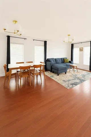 a living room with lots of furniture and a table