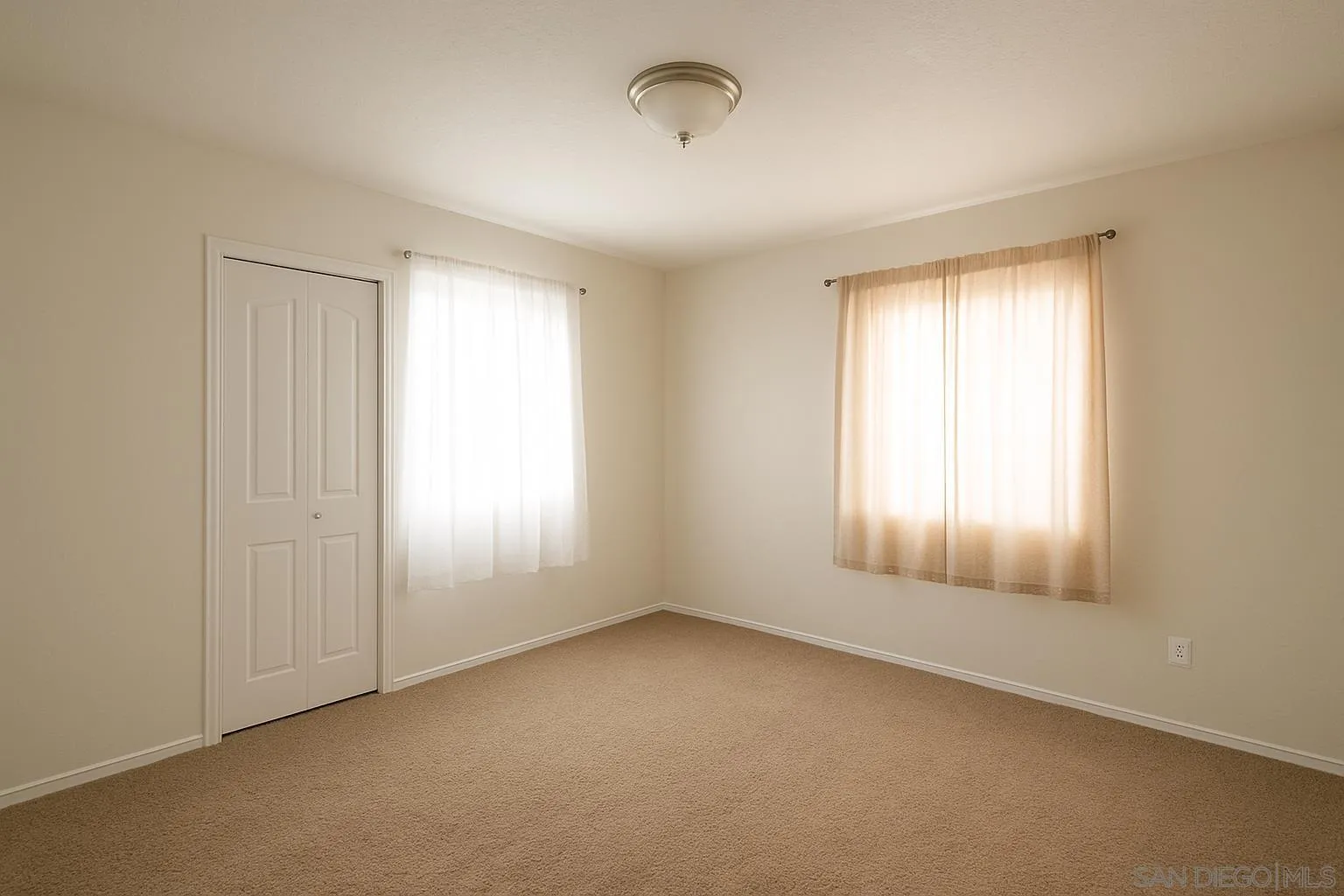 5295 36th Street Riverside, CA 92509 - Photo 4 of 7 an empty room with windows and closet