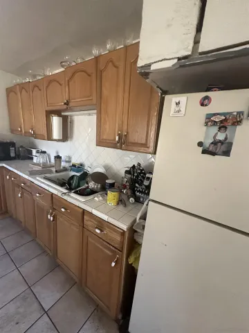 a kitchen with a sink a stove and refrigerator