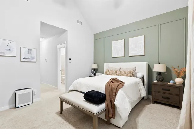 a bedroom with a bed and a couch