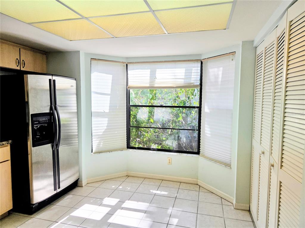 3239 Lori Lane, Unit 3239 New Port Richey, FL 34655 - Photo 11 of 33 a view of a room with window and refrigerator