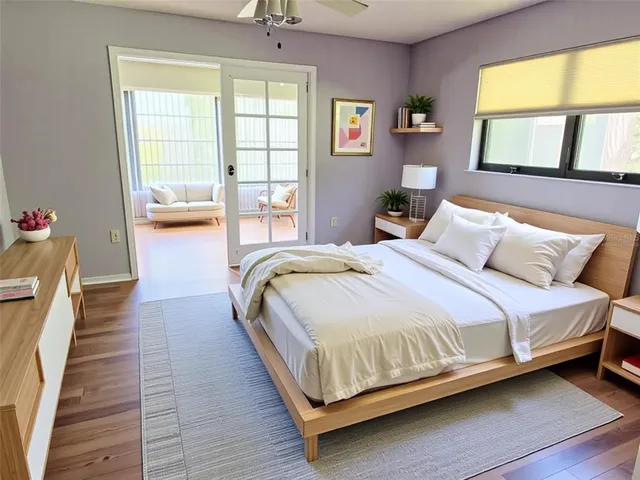 an empty room with wooden floor and a window
