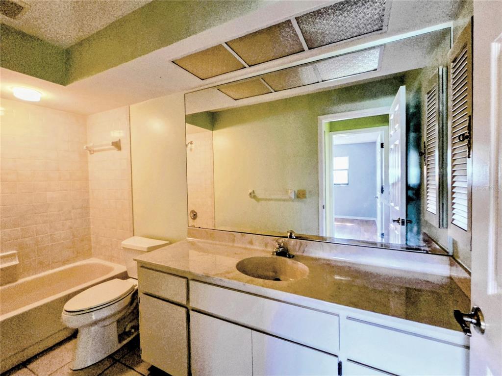 3239 Lori Lane, Unit 3239 New Port Richey, FL 34655 - Photo 19 of 33 a bathroom with a sink and a mirror