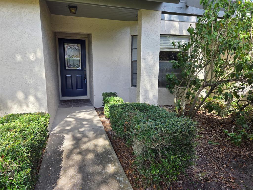 3239 Lori Lane, Unit 3239 New Port Richey, FL 34655 - Photo 2 of 33 front view of a house with a yard