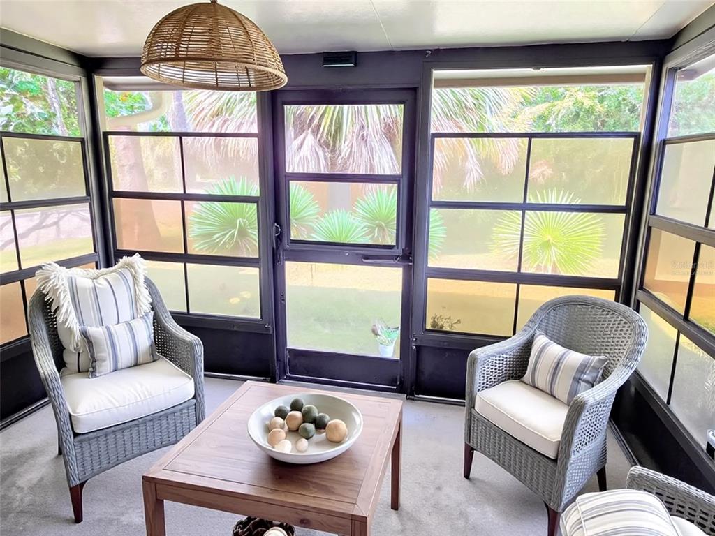 3239 Lori Lane, Unit 3239 New Port Richey, FL 34655 - Photo 21 of 33 a living room with furniture and a large window