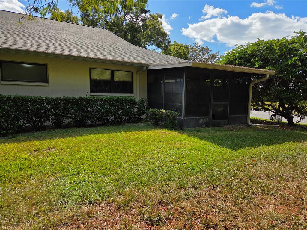 3239 Lori Lane, Unit 3239 New Port Richey, FL 34655 - Photo 23 of 33 a view of a house with a yard