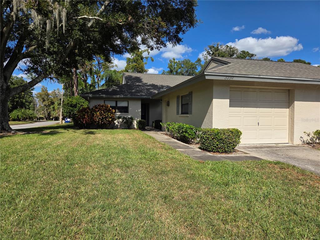 3239 Lori Lane, Unit 3239 New Port Richey, FL 34655 - Photo 33 of 33 a house view with a garden space