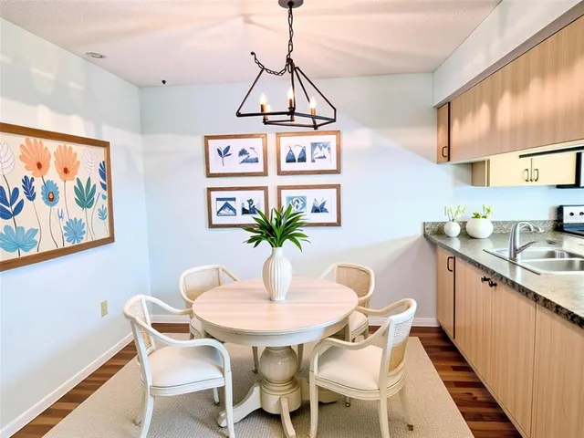 a dining room with furniture and window