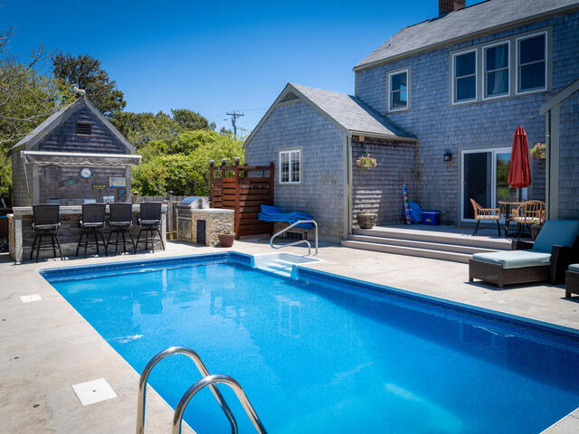 33 Bartlett Road Nantucket, MA 02554 - Photo 28 of 29 a view of house with outdoor seating