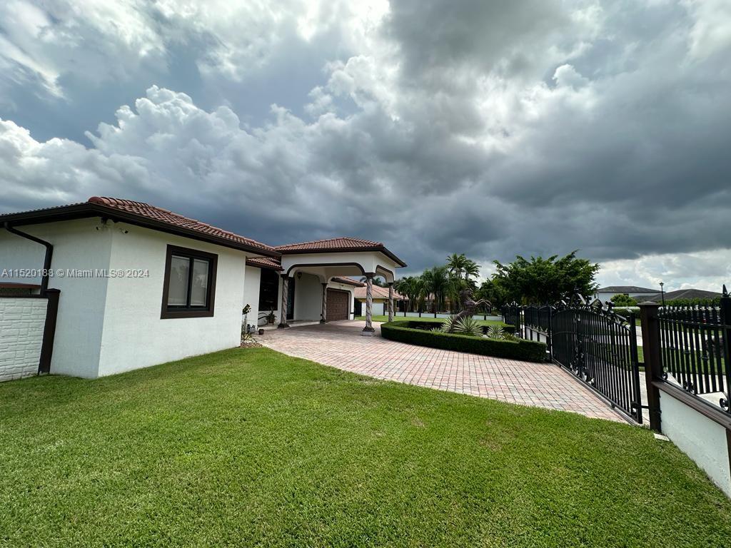 13430 Southwest 192nd Street Miami, FL 33177 - Photo 11 of 37 a house view with swimming pool in front of it