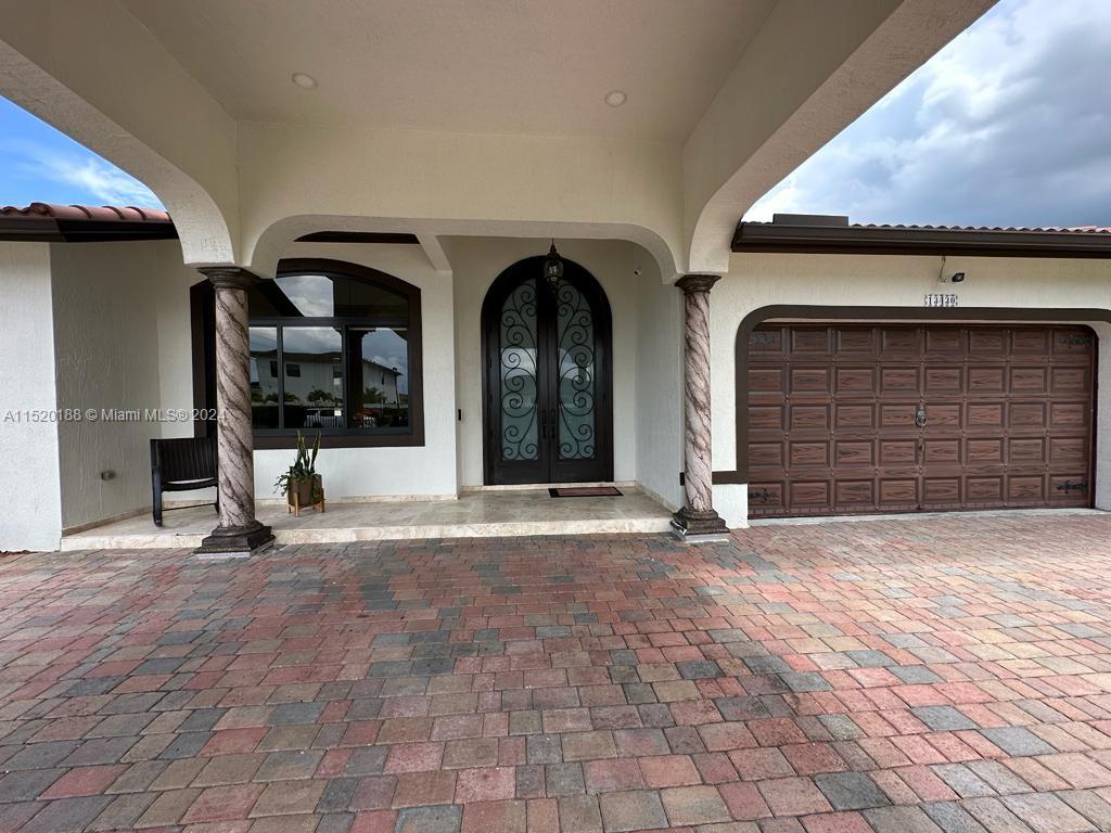 13430 Southwest 192nd Street Miami, FL 33177 - Photo 12 of 37 a view of front door of house