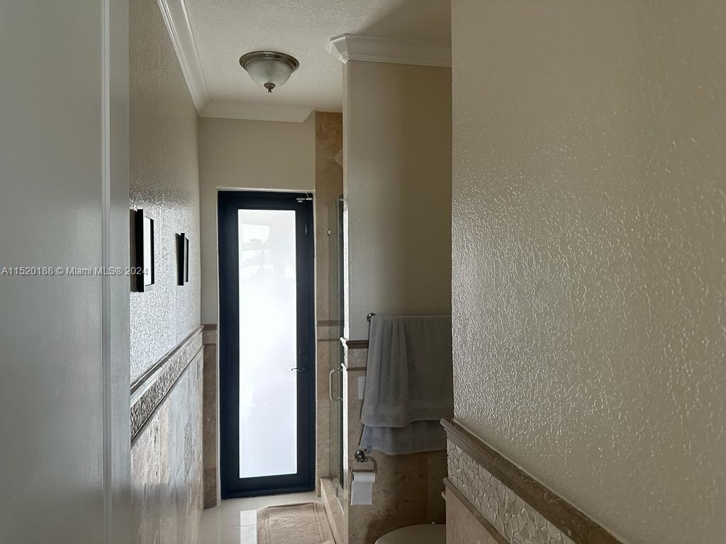 13430 Southwest 192nd Street Miami, FL 33177 - Photo 17 of 37 a view of a hallway with wooden floor and staircase