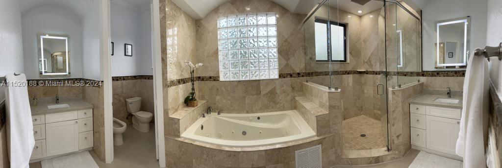13430 Southwest 192nd Street Miami, FL 33177 - Photo 27 of 37 a bathroom with a bathtub and shower