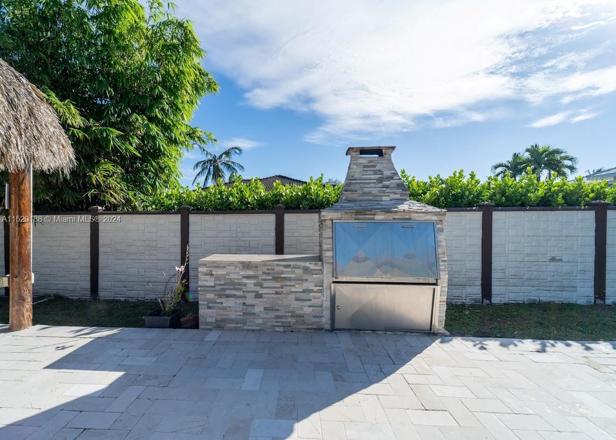 13430 Southwest 192nd Street Miami, FL 33177 - Photo 33 of 37 a view of a terrace with a garden