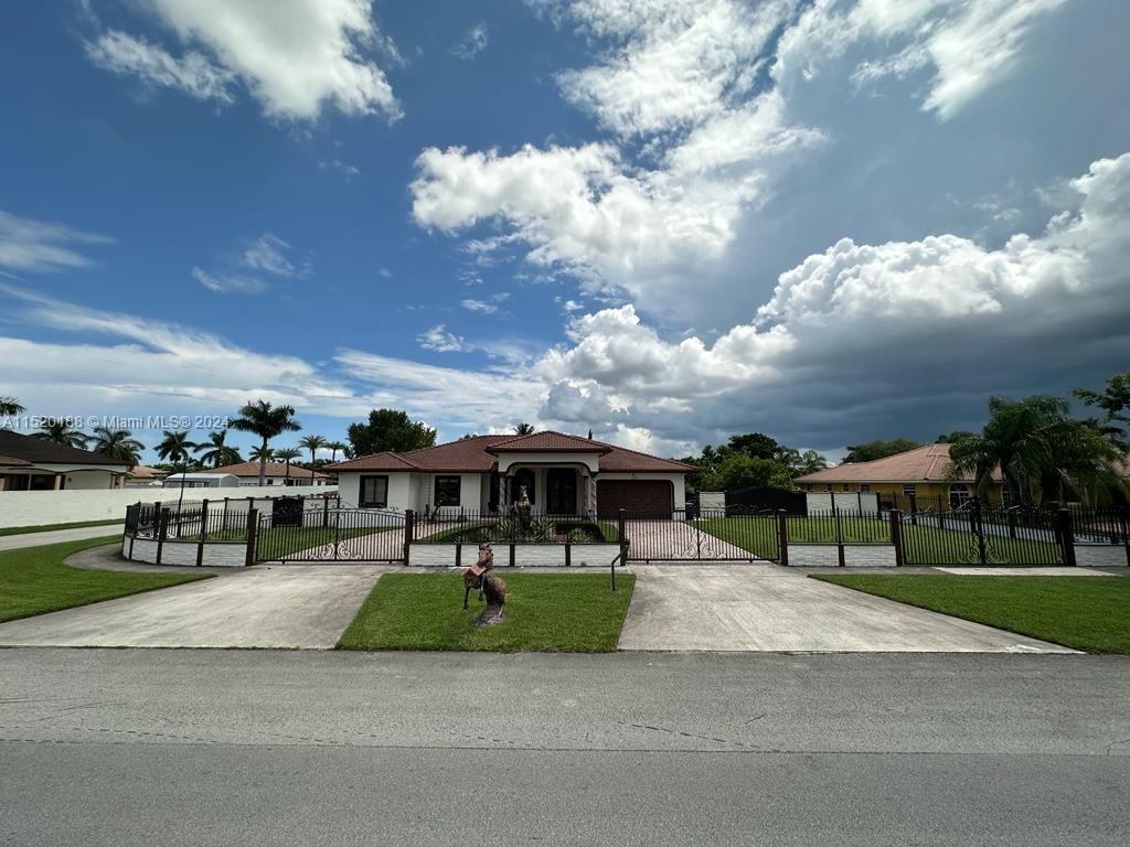 13430 Southwest 192nd Street Miami, FL 33177 - Photo 7 of 37 a view of swimming pool with outdoor seating and a garden