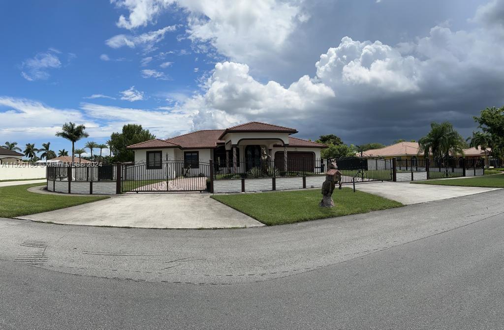 13430 Southwest 192nd Street Miami, FL 33177 - Photo 8 of 37 a front view of house with yard and entertaining space