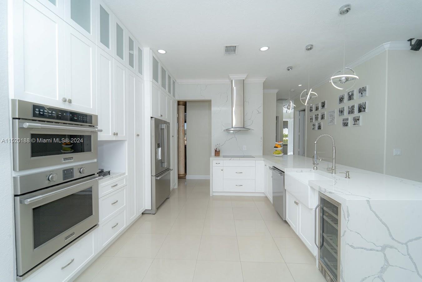 13430 Southwest 192nd Street Miami, FL 33177 - Photo 9 of 37 a kitchen with a sink stove and refrigerator