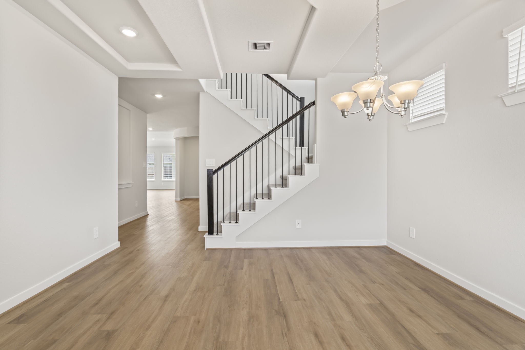 6606 Lenwood Lane Rosharon, TX 77583 - Photo 11 of 33 a view of a hallway with wooden floor