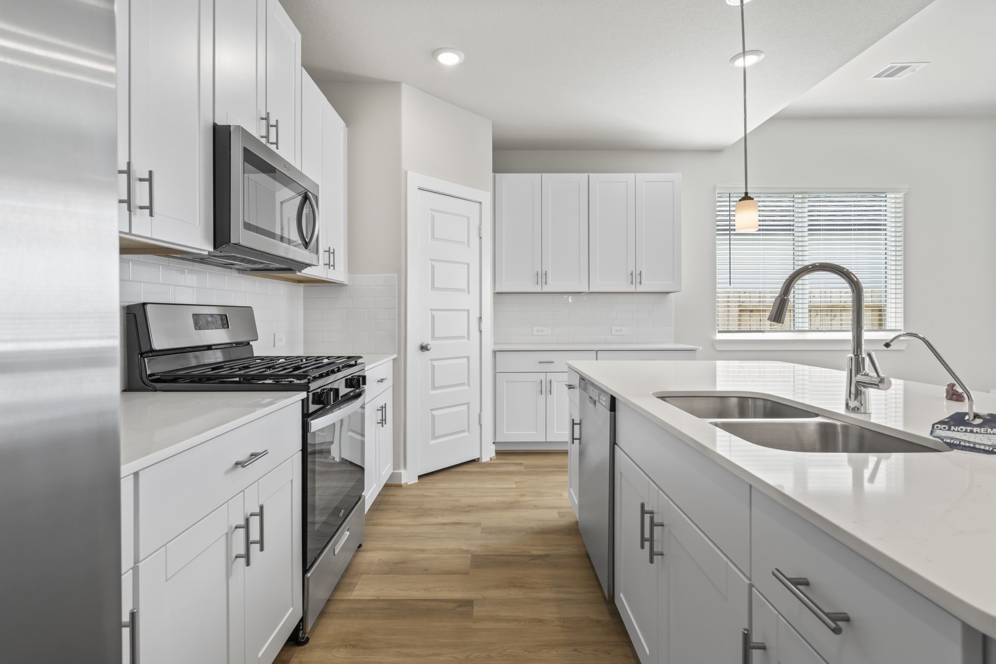 6606 Lenwood Lane Rosharon, TX 77583 - Photo 16 of 33 a kitchen with stainless steel appliances granite countertop a sink stove and cabinets