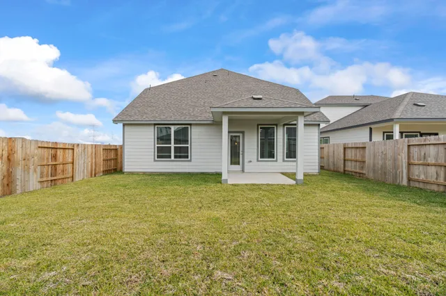 a kitchen with kitchen island a white counter top space cabinets and stainless steel appliances